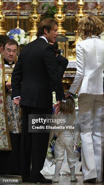 Elle Macpherson with her partner Arpad Busson and their sons Flynn and Aurelius arrive to attend the christening of Aurelius at Basilca Santa Maria...
