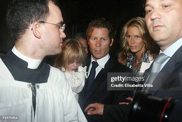 Elle Macpherson with her partner Arpad Busson and their sons Flynn and Aurelius arrive to attend the christening of Aurelius at Basilca Santa Maria...