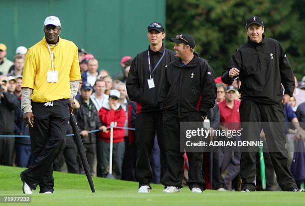 Former NBA legend Michael Jordan watches the action with United States Ryder Cup player J.J. Henry and other squad members in the afternoon foursomes...