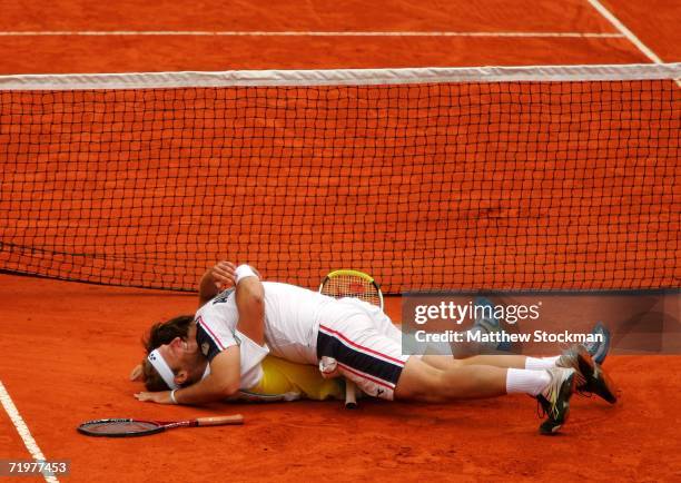 David Nalbandian and Agustin Calleri of Argentina celebrate match point against Wayne Arthurs and Paul Hanley of Australia during the World Group...