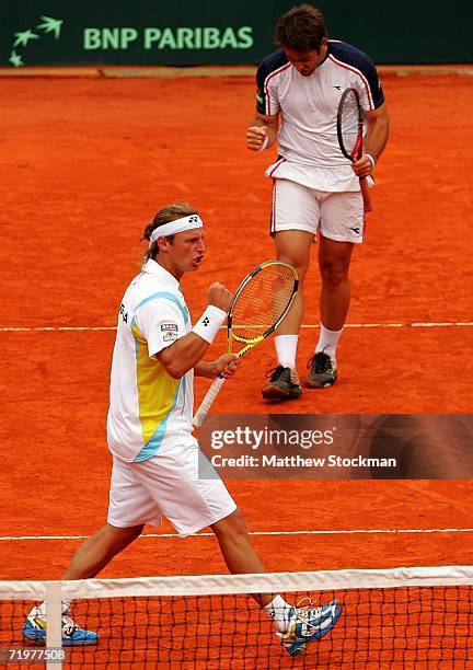 David Nalbandian and Agustin Calleri of Argentina celebrate a point against Wayne Arthurs and Paul Hanley of Australia during the World Group...