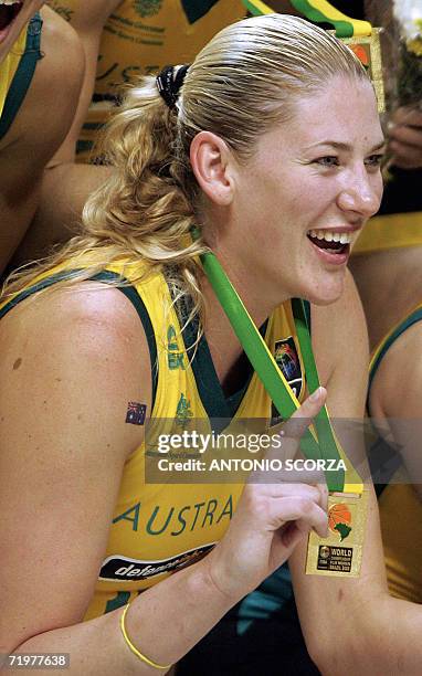 Australian basketball women's team player Lauren Jackson holds the medal and makes the "number one" sign in celebration after defeating Russia to win...