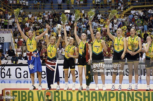 Team Australia waves to the crowd on the gold medal stand after the during the gold medal game during the gold medal game between Australia and...