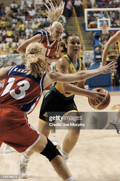 Tully Belivaqua of Australia drives past Elena Karpova of Russia during the gold medal game between Australia and Russia during the 2006 FIBA World...