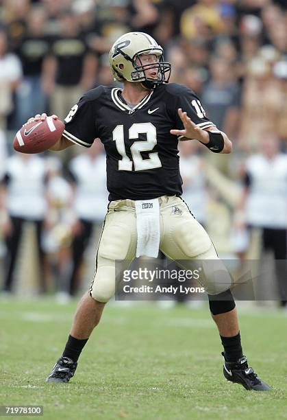 Curtis Painter of the Purdue Boilermakers gets set to throw a pass against the Minnesota Golden Gophers during a Big Ten Conference game September...