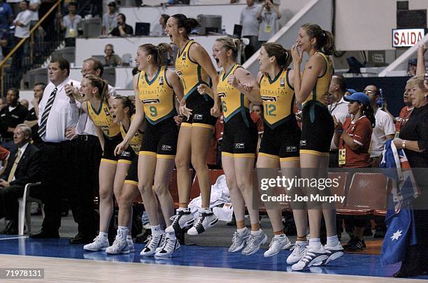 The Australia bench celebrates in the last seconds of the gold medal game during the gold medal game between Australia and Russia during the 2006...