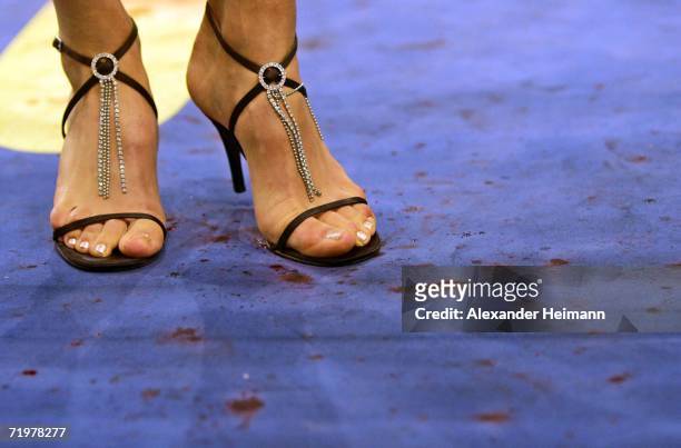 The feet of a numbergirl are seen in the blood of wounded Arthur Abraham after his victory during the IBF World Championship Middleweight fight...