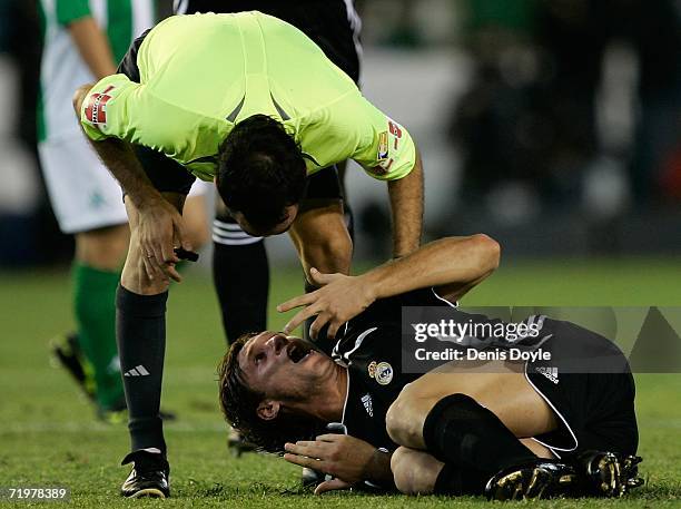 Antonio Cassano of Real Madrid complains to referee Iturralde Gonzalez after he was tackled in the Primera Liga match between Real Betis and Real...