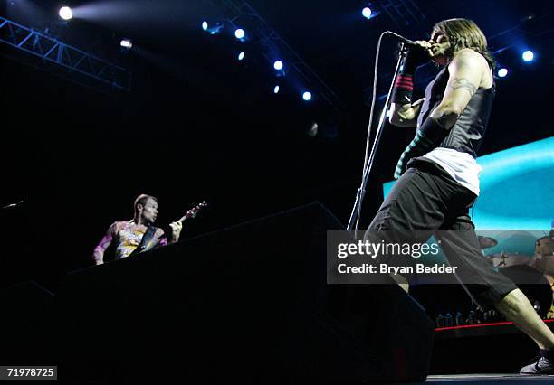 Flea and singer Anthony Kiedis of Red Hot Chili Peppers perform onstage at the Virgin Festival by Virgin Mobile at Pimlico Race Course on September...