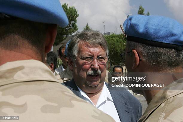 Belgian Defence Minister Andre Flahaut reviews UNIFIL soldier during his visit at the UNIFIL camp in Tibnine in South Lebanon, 24 September 2006....