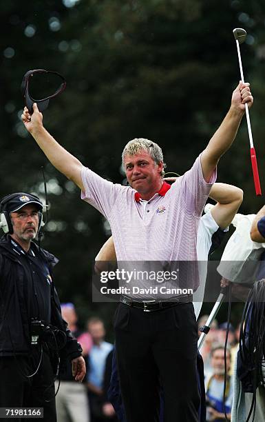 Darren Clarke of Europe salutes the crowd on the 16th green after winning his singles match against Zach Johnson of USA on the final day of the 2006...