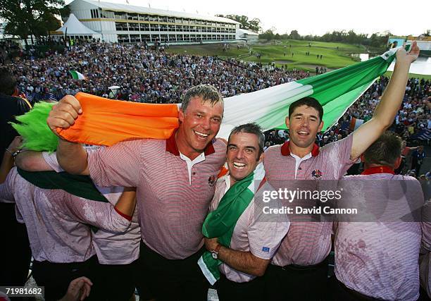 Darren Clarke of Europe celebrates with team mates Paul McGinley and Padraig Harrington after Europe win the Ryder Cup by a score of 18 1/2 - 9 1/2...