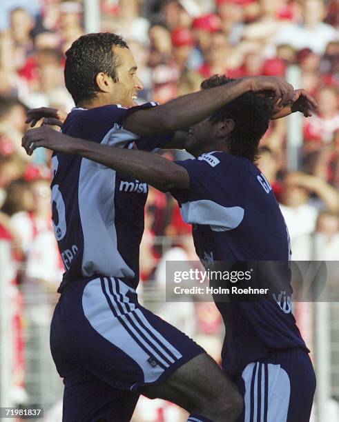 Jawhar Mnari and and Glauber of Nuremberg celebrate the first goal during the Bundesliga match between Energie Cottbus and 1. FC Nuremberg at the...