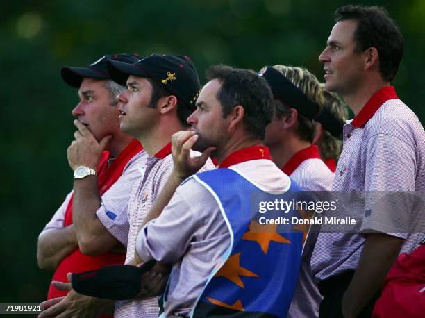 Paul Casey and David Howell of Europe watch the action with their caddies during the singles matches on the final day of the 2006 Ryder Cup at The K...