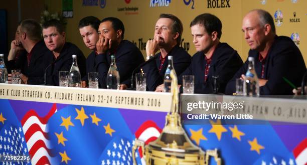 Scott Verplank, JJ Henry, Tiger Woods, David Toms, Zach Johnson and Team Captain Tom Lehman of the USA answer questions from the media during a press...