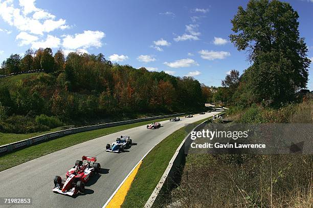 Justin Wilson driver of the RuSPORT Lola Cosworth leads a group of cars during the Champ Car World Series Grand Prix of Road America on September 24,...