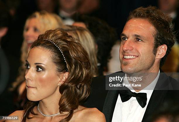 Rebecca Twigley and Chris Judd look on during the final rounds of counting at the West Coast Eagles 2006 AFL Brownlow Medal Dinner at the Burswood...