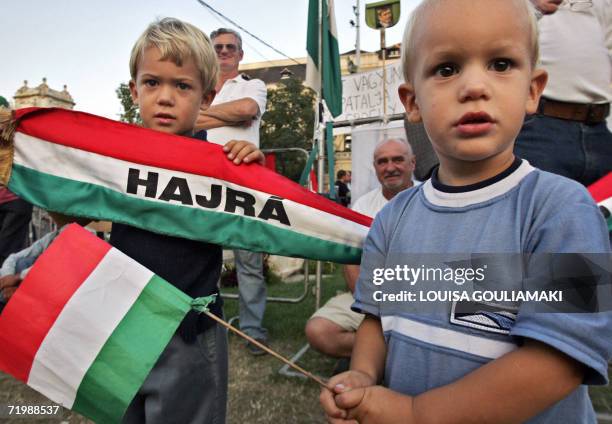 Children hold hungarian flags while their family attends the rally in front of the Hungarian parliament in Budapest, 25 September 2006 Demonstrations...