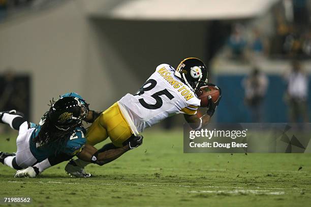 Flanker Nate Washington of the Pittsburgh Steelers is tackled by cornerback Rashean Mathis of the Jacksonville Jaguars during the game at Alltel...