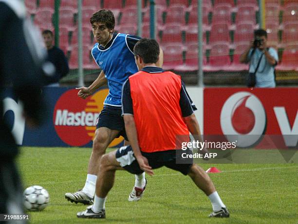 Juninho Pernambucano from Lyon hits the ball during a training session at Ghencea stadium in Bucharest, 25 September 2006. Lyon will play 26...