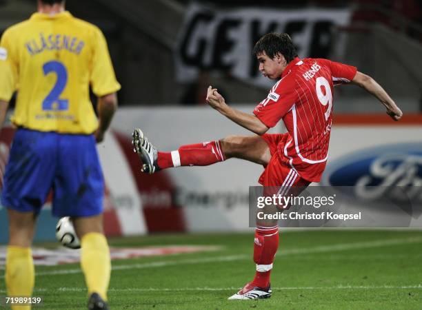 Patrick Helmes of Cologne scores the first goal during the Second Bundesliga match between 1.FC Cologne and Rot Weiss Essen at the RheinEnergie...