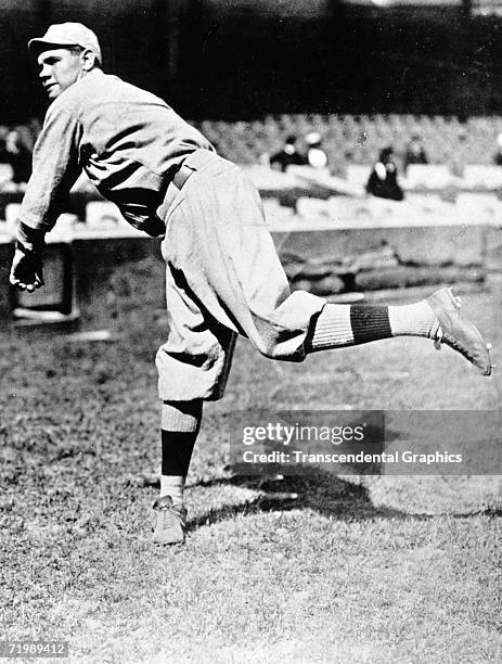 Babe Ruth, Boston Red Sox pitcher, warms up in Fenway Park before a contest in the 1918 season.