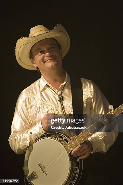 Banjo Player Markus Schmidt of the German country band "Texas Lightning" performs live during a concert at the Columbiahalle September 25, 2006 in...