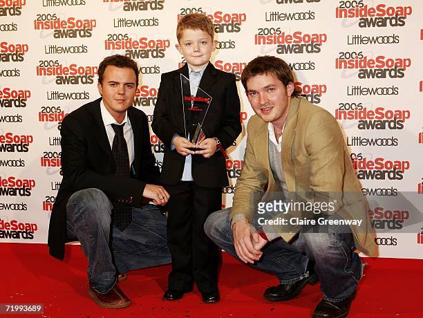 Actors Darren Jeffries, Ellis Hollins and Matt Littler pose with the Best Young Actor award, presented to Hollins, at the Inside Soap Awards 2006 at...