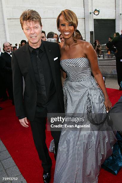 Singer David Bowie and model Iman attend the Metropolitan Opera 2006-2007 season opening night at Lincoln Center September 25, 2006 in New York City.