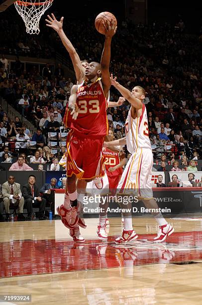 Thaddeus Young of the East shoots a layup against James Keefe of the West during the 2006 McDonald's All American High School Basketball game at Cox...