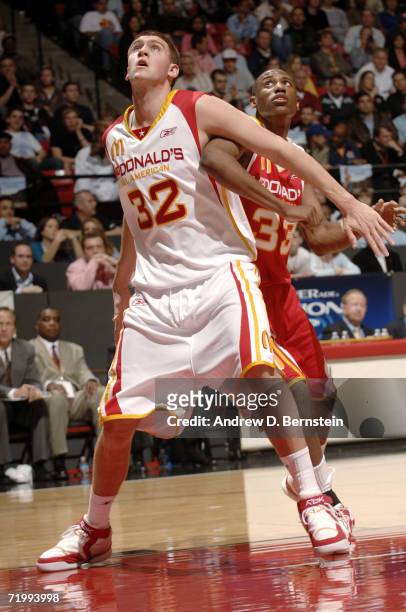 Spencer Hawes of the West tries to get position against Thaddeus Young of the East during the 2006 McDonald's All American High School Basketball...