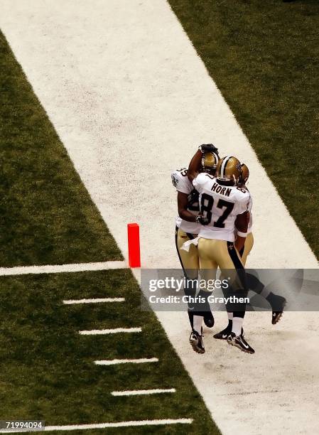 Curtis DeLoatch of the New Orleans Saints celebrates with his teammates after scoring a touchdown after recovering a blocked punt by the Atlanta...