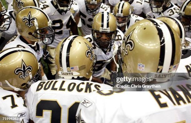 Wide Receiver Joe Horn of the New Orleans Saints yells to his team in a huddle prior to the start of the Monday Night Football game against the...