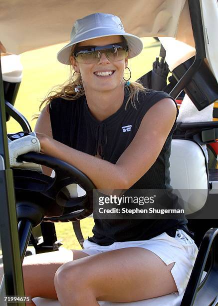 Professional golfer Anna Rawson steers the golf cart at the 9th annual American Film Institute Golf Classic at he Trump National Golf Club September...