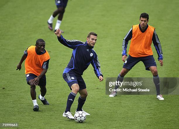 Andriy Shevchenko shields the ball from Shaun Wright Phillips as Michael Ballack looks on during the Chelsea Training session ahead of the UEFA...