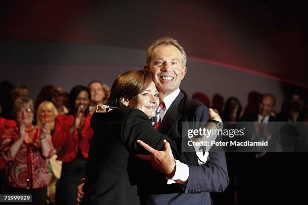 Prime Minister Tony Blair receives a hug from his wife Cherie after giving his final conference speech on September 26, 2006 in Manchester, England....