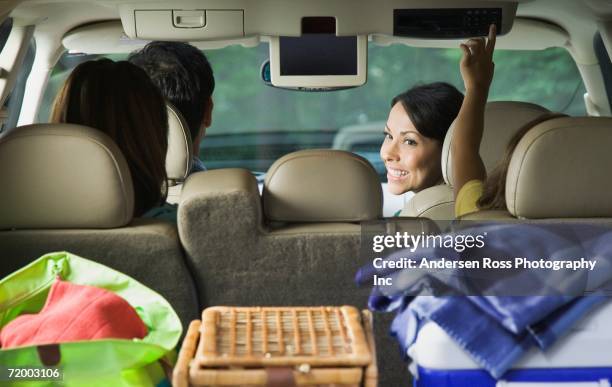 family in car with cooler and picnic basket - family inside car stockfoto's en -beelden