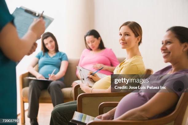 group of pregnant women in waiting room - antenatal class stock pictures, royalty-free photos & images