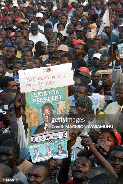 Supporters of Zambian opposition Patriotic Front leader Michael Sata attend a rally 26 September 2006 in Lusaka. Sata has emerged as the main...
