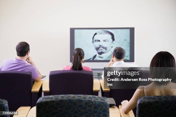 group of people watching television - television academy stock pictures, royalty-free photos & images