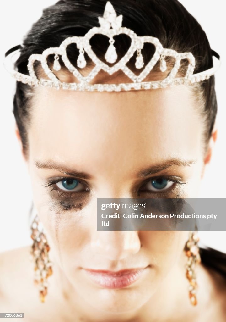 Woman wearing tiara and crying
