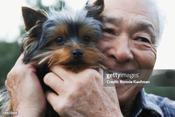 senior asian man with small dog - japanese old man foto e immagini stock