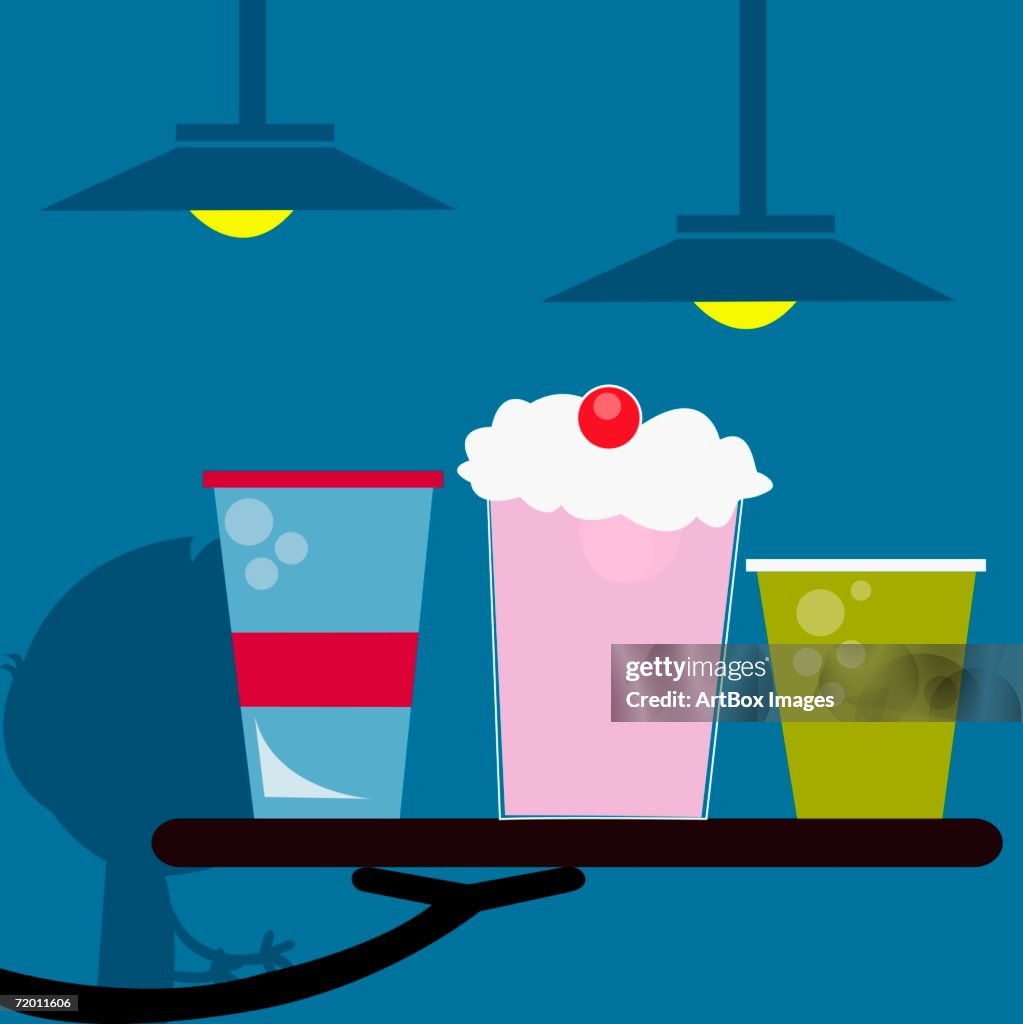 Close-up of an ice-cream float with a glass of juice on a tray