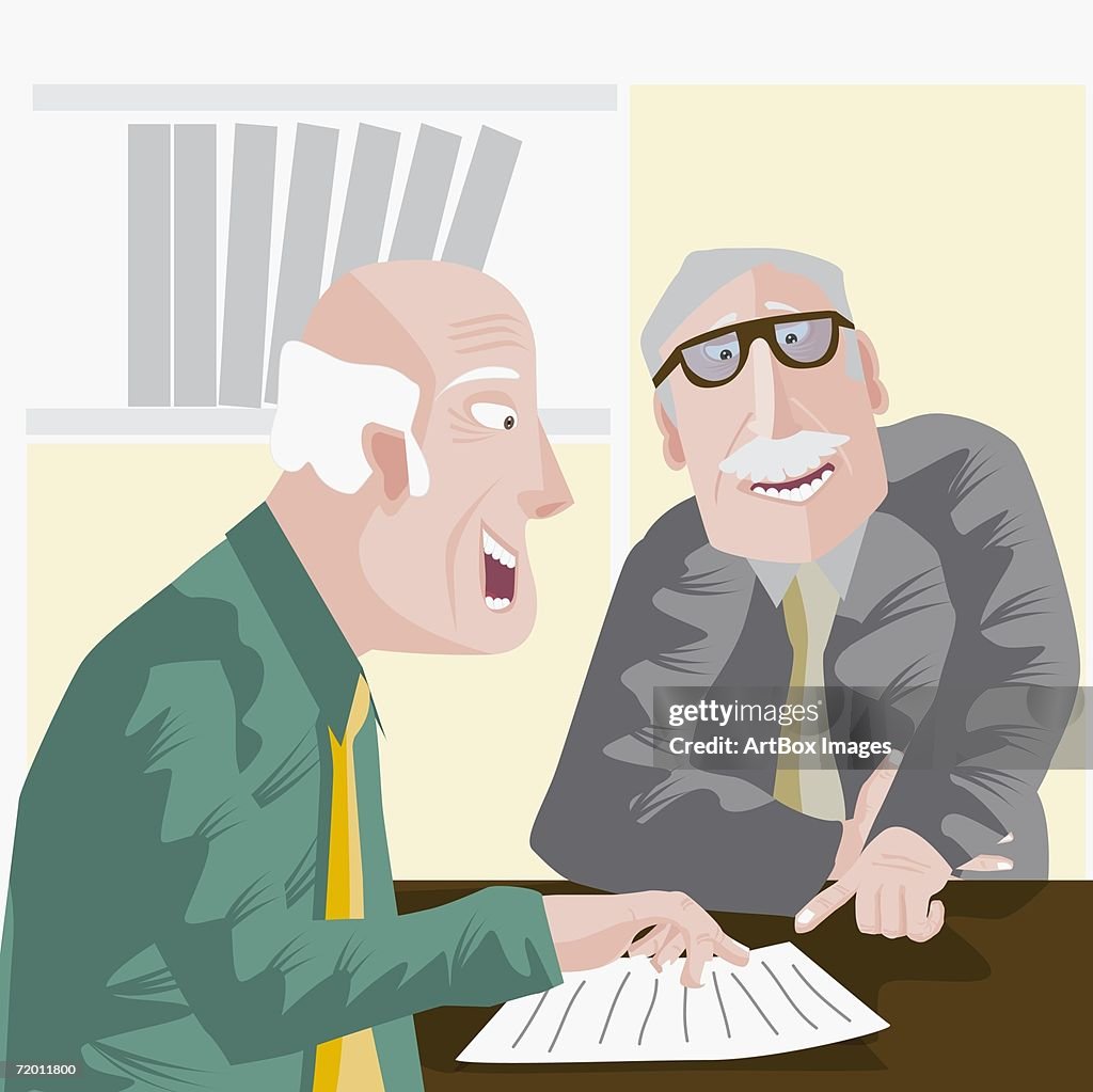 Close-up of two businessmen discussion in an office