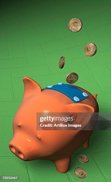 high angle view of coins falling on a piggy bank - saving up for a rainy day stock illustrations