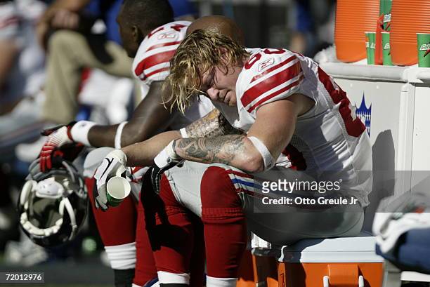 Tight end Jeremy Shockey of the New York Giants sits on the bench on the sideline in the second half of the game against the Seattle Seahawks at...