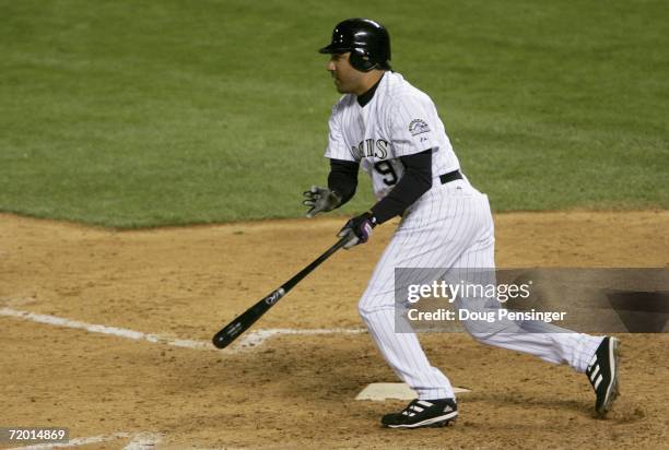 Vinny Castilla of the Colorado Rockies heads for first on a two out pinch hit single in the 8th inning off of Brett Tomko of the Los Angeles Dodgers...