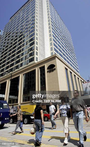 AFPLifestyle-HongKong-hotel,sched-ADVANCER" This photo taken 26 September, 2006 shows pedestrians walking past the newly-renovated Mandarin Oriental...