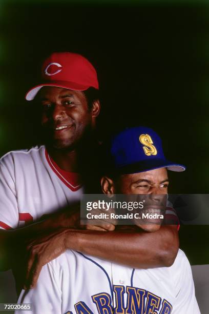 Ken Griffey Jr. #24 of the Seattle Mariners poses with his father Ken Griffey Sr. #30 of the Cincinnati Reds in July ,1989 in Cincinnati, Ohio.