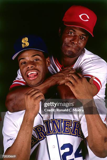 Ken Griffey Jr. #24 of the Seattle Mariners poses with his father Ken Griffey Sr. #30 of the Cincinnati Reds in July ,1989 in Cincinnati, Ohio.